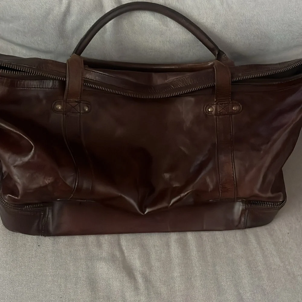 Pottery Barn Grant Dark Brown Leather Duffel Bag with Top Handles.